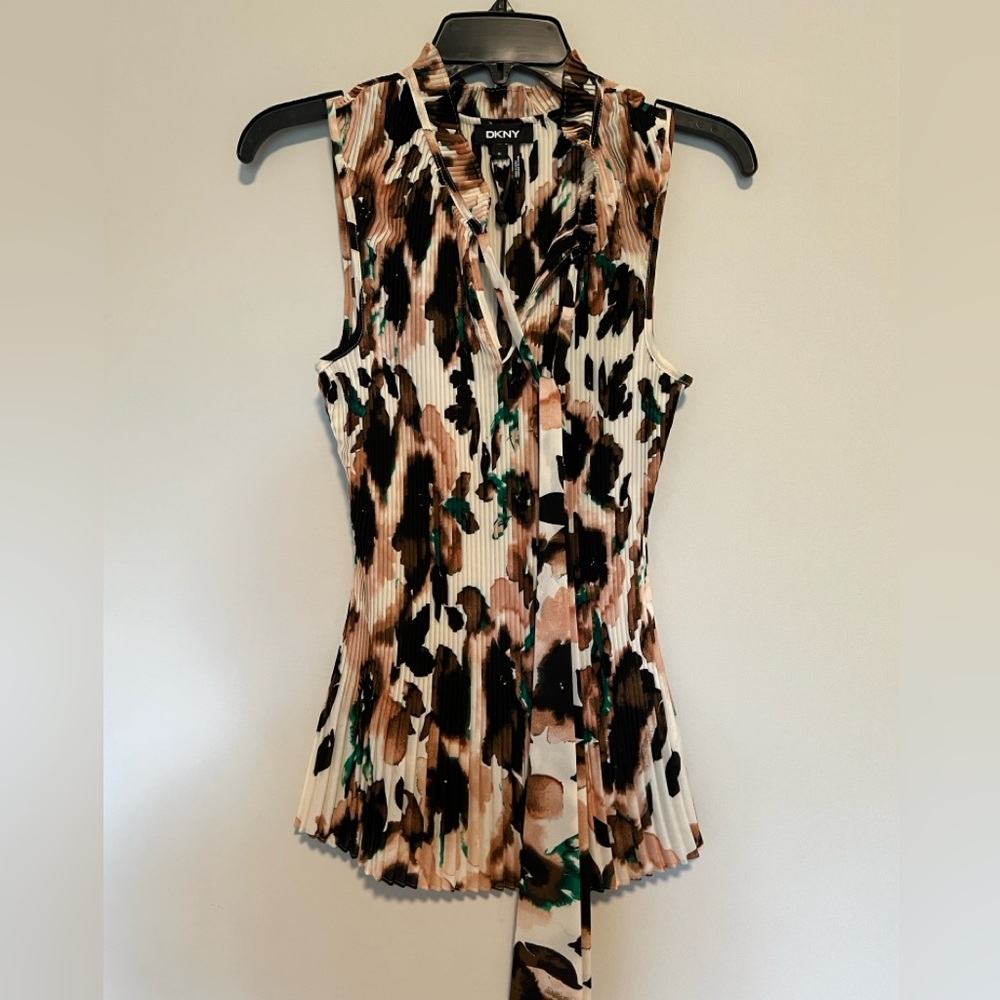 DKNY Size M sleeveless v-neck pleated shirt with ties draping the front.
